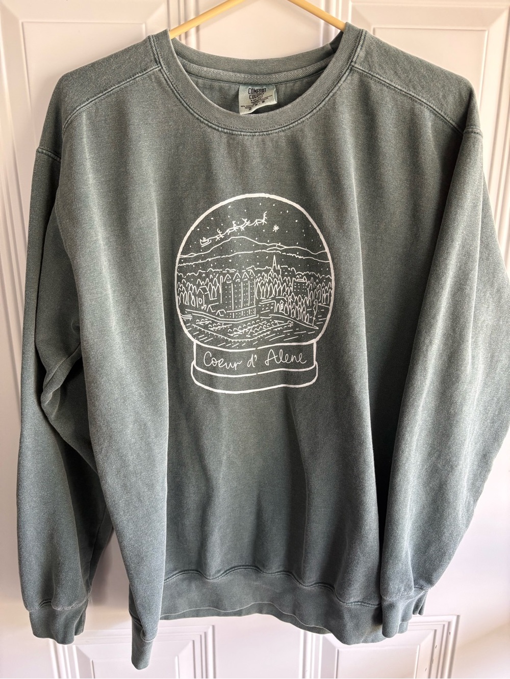 Comfort Colors Sage Green Crewneck Sweatshirt with White Snowglobe Graphic
